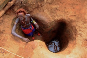 Nairobi, Kenya. A man tries to get clean water during the drought in northern Kenya resulting in food and water shortages