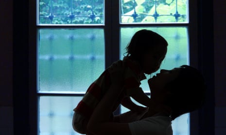 Silhouette of  mother holding her daughter
