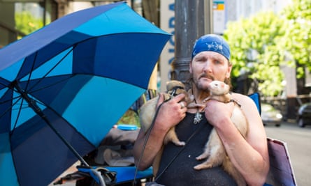 Richard Dyer with his pet ferrets Ricky and Tiny in Seattle, Washington
