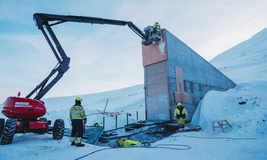Construction workers add the finishing touches to the seed vault.