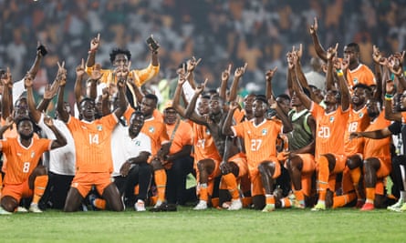 The Ivory Coast squad celebrate in Yamoussoukro after sealing a quarter-final against either Mali or Burkina Faso on Saturday.