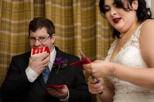 Man eating cake and woman with knife