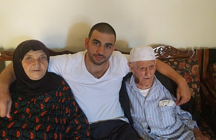 Ali Hamka with his late grandfather Fairzad and his grandmother Faizah Saad at their home in Bint Jbeil