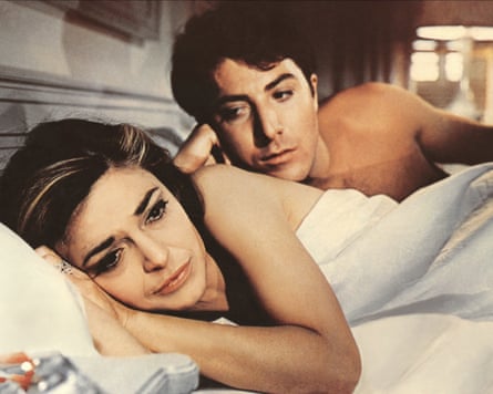 Anne Bancroft and Dustin Hoffman lying in bed together