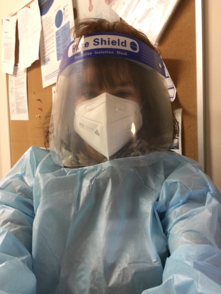 Carrie Tiffany wearing a face mask, face shield and blue medical gown