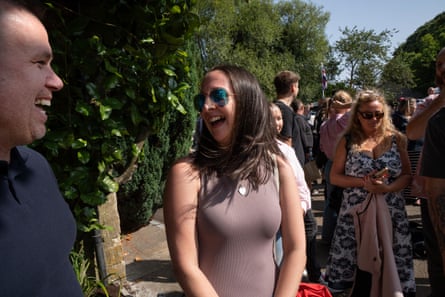Blake Jones and Laura Hanly laugh in the queue