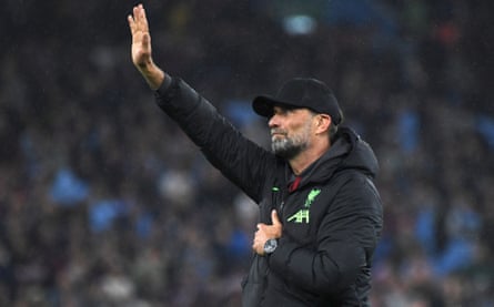 Jürgen Klopp waves to the visiting fans at full time