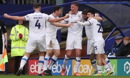 Tranmere celebrate after Jordan Turnbull (second right) scores in the win at home to high-flying Stockport.