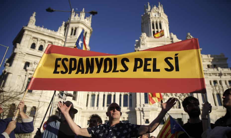 Supporters of Catalan independence hold a banner reading in Catalan “ Spaniards for Yes” during a protest in Madrid.