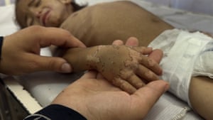 A child’s hand in the hand of an adult