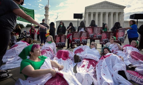 Abortion rights supporters stage a ‘die-in’ outside the supreme court.
