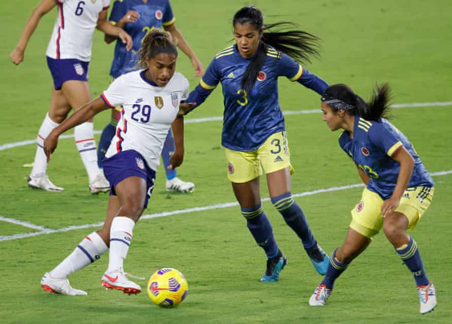 Soccer: U.S. Women’s National Team International Friendly Soccer-Colombia at USAJan 18, 2021; Orlando, Florida, USA; Colombia defender Daniela Arias (3) and defender Nancy Acosta (23) defend against United States midfielder Catarina Macario (left) takes on Colombia defenders Daniela Arias and defender Nancy Acosta (right) during her USA debut on 18 January 2021.