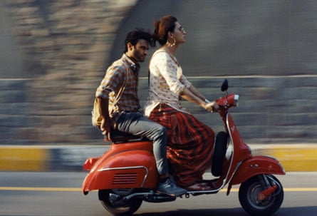 Alina Khan as Biba rides on a scooter with Ali Junejo as Haider on the back in a still from Joyland.