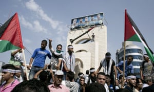 A Palestinian man holds a knife