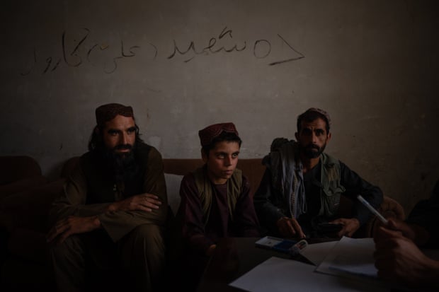 Rahmanullah, 12, applies for aid at the district governor’s house in Jalrez in the province of Wardak
