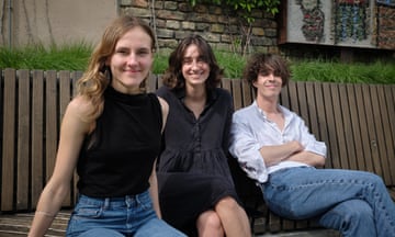Three young people smiling