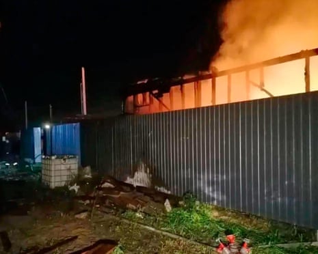 Flame and smoke rise from a construction site after a Ukrainian drone attack in an undisclosed area in the Moscow region, Russia.