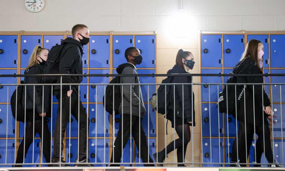 Pupils wear face coverings in school corridors. 