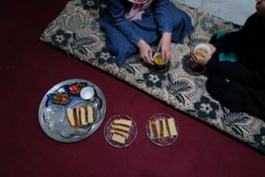 Hawa, 20, a third-year Russian literature student at the Burhanuddin Rabbani University (which was renamed by the Taliban to Kabul Education University), has tea with her sister, at their home.