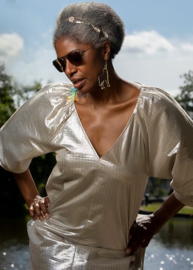DJ Paulette in fabulous silver lamé puff-sleeve outfit.