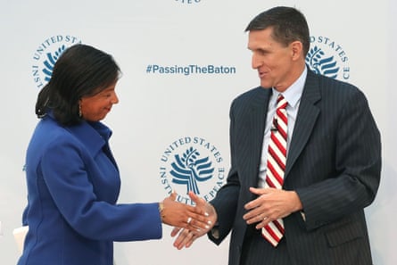 Susan Rice, shakes hands with Michael Flynn, during the 2017 Passing The Baton conference at the United States Institute of Peace.