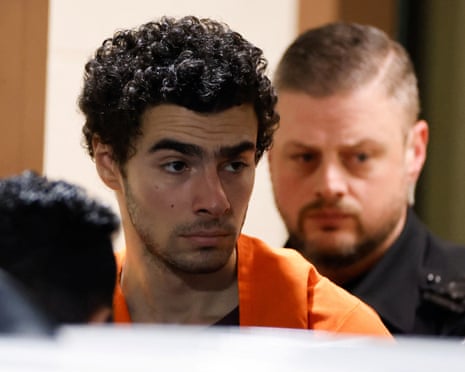 a man with police behind him