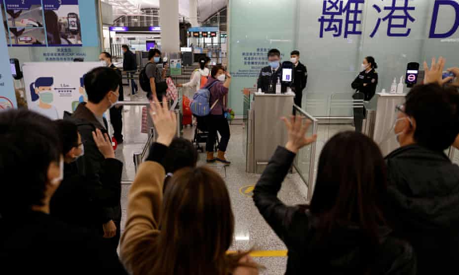 people waving goodbye at Hong Kong airport