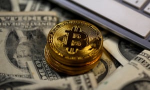 Bitcoins placed on dollar banknotes