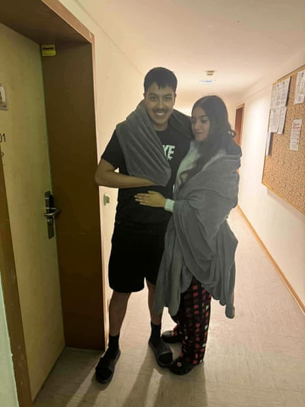 a man and a woman stand together