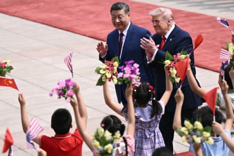 Donald Trump and Xi Jinping greet children waving Chinese and US national flags