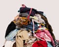 A big pile of clothes and accessories thrown on the floor