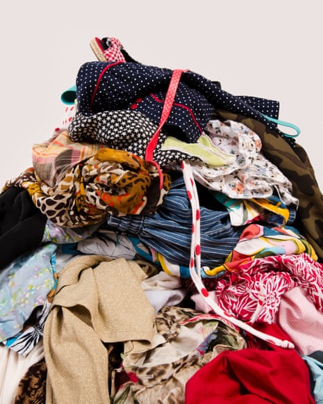A big pile of clothes and accessories thrown on the floor
