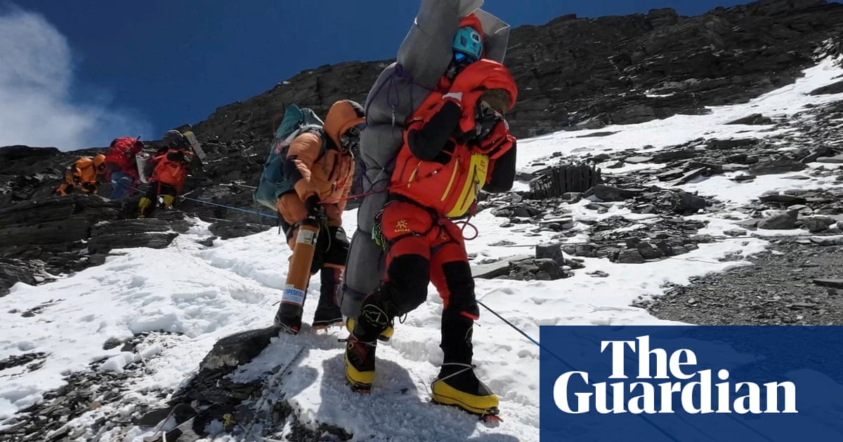 A Malaysian climber narrowly survived after a Nepali sherpa guide hauled him down from below the summit of Mount Everest in a very rare high-altitude 