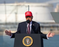 Man in red hat at podium