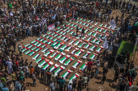 Palestinians gather during a mass funeral for 112 members of the Abu Sharia and Al-Hasayna families in the eastern Gaza City, 04 August 2026.