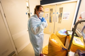 After a 8am-9pm shift Helen Simpson, exhausted, is delighted to take her PPE off.