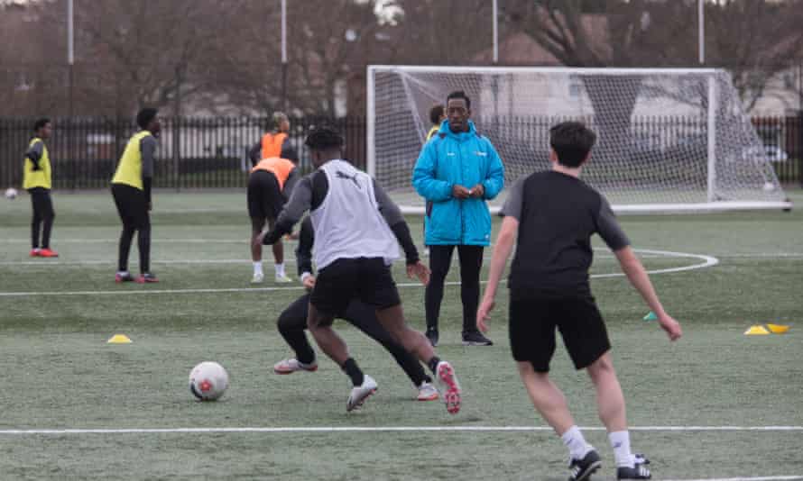 Assistant manager Lloyd Doyley, the former Watford defender, with Boreham Wood youth team players in training.