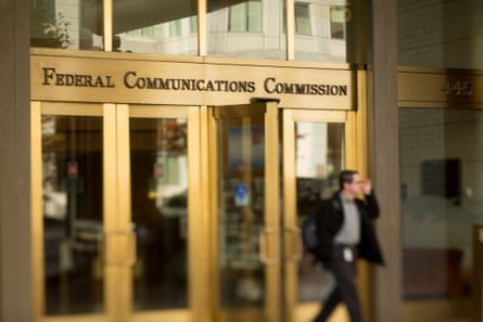 A man walks out of the Federal Communications Commission (FCC) headquarters in this photo taken with a tilt-shift lens in Washington, D.C., U.S