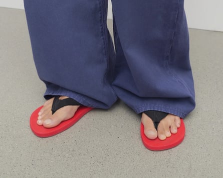 Red-soled flip flop
