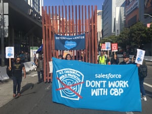 Protesters in San Francisco carried a cage to protest Salesforce’s contract with CBP.