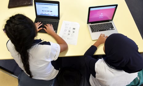 Students use laptop computers during a class.