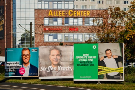 Posters of top candidates for the Berlin state parliament election show the CDU's Stefan Evers, the SPD's Steffen Krach and the Green party's Werner Graf beside a road in Berlin.