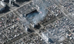 Multiple destroyed apartment buildings seen on fire in Mariupol, Ukraine