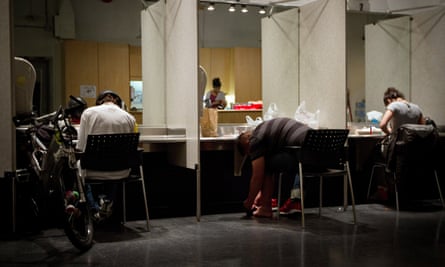 Addicts inject themselves at the Insite supervised injection center in Vancouver.