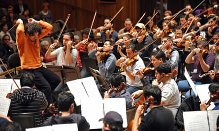 Dudamel rehearses with the Simón Bolívar Youth Orchestra in 2009. Photograph: Leon Neal/AFP/Getty Images