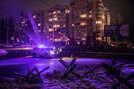A police checkpoint near a residential building hit by Russian missiles in Vyshhorod, a suburb in Kyiv