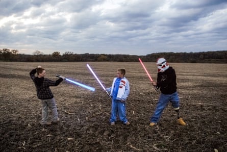 Raymond Hubbard plays Star Wars with his sons Brady and Riley.