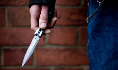 A person brandishing a knife