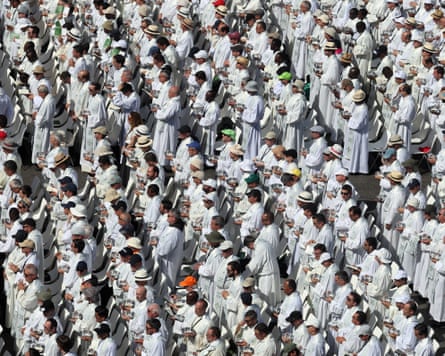 Rows of people dressed in white