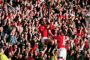 Eric Cantona celebrates scoring on his comeback.